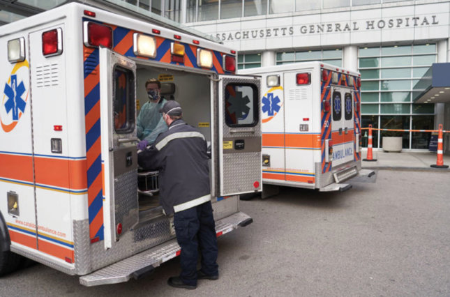 Ambulance and health care worker outside Massachusetts General Hospital