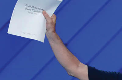 At the 2016 Democratic National Convention, a delegate holds up a copy of the Democratic Party Platform.