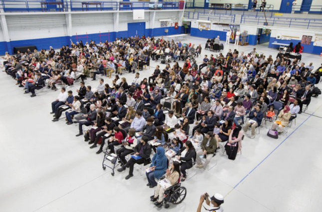 More than 250 people are shown becoming new Canadians at a citizenship ceremony on May 2, 2020, held at the Royal Canadian Navy local reserve division HMCS York.