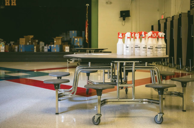 Cleaning supplies on the table of a school cafeteria