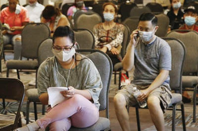 People waiting to file claims at the Oklahoma Employment Security Commission in July 2020