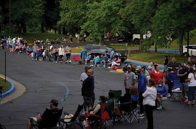 People line up outside a Kentucky career center seeking assistance with their unemployment claims June 18,2020