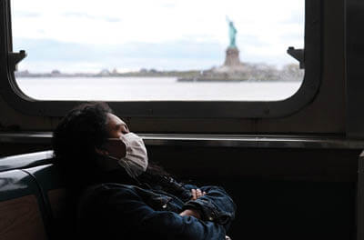 The Staten Island Ferry passing the Statue of Liberty in New York City