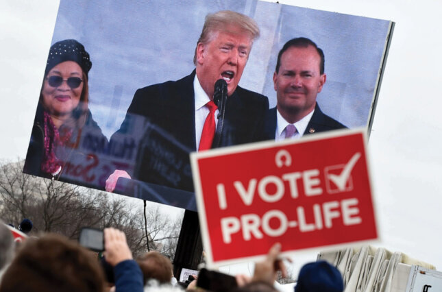 Anti-abortion demonstrators listen to President Trump at the March for Life in Washington in January 2020