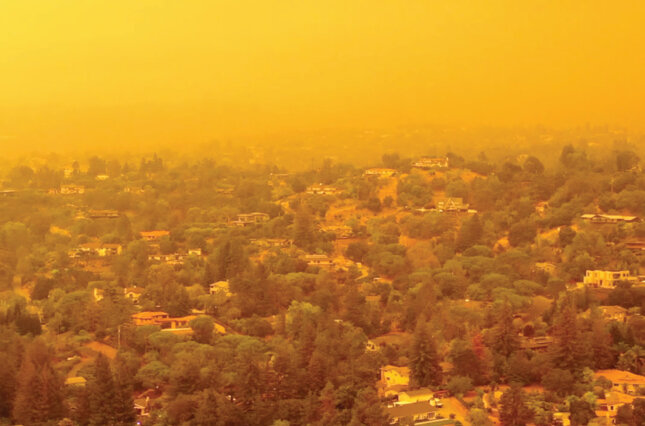 An orange sky blocks out the sun over the San Francisco Bay area during this summer's California wild fires