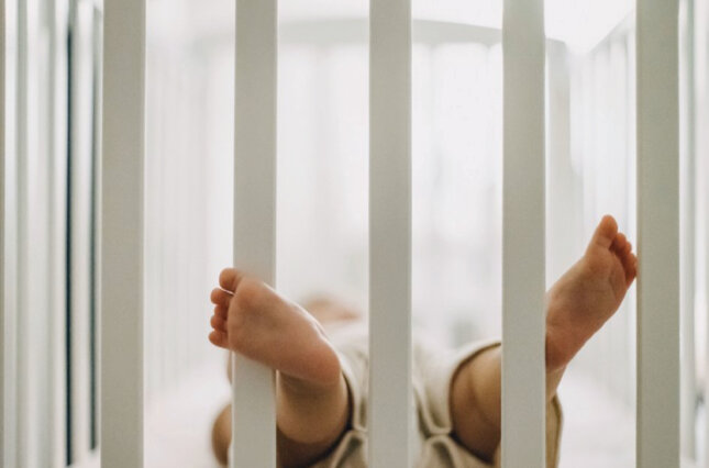 Photo of a baby in a crib