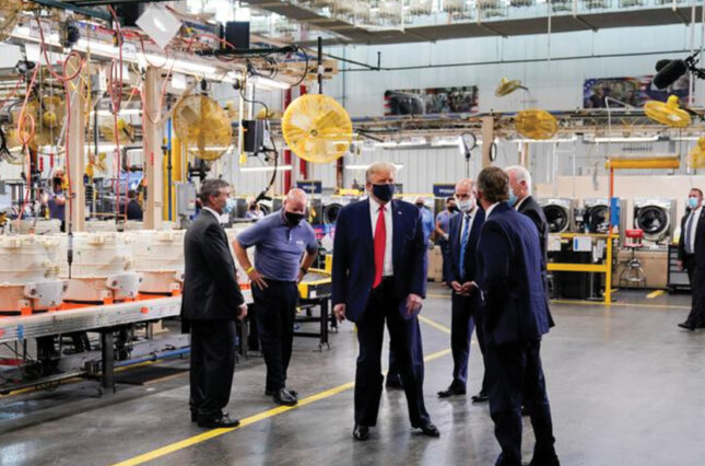 Donald Trump tours the assembly line at a Whirlpool factory