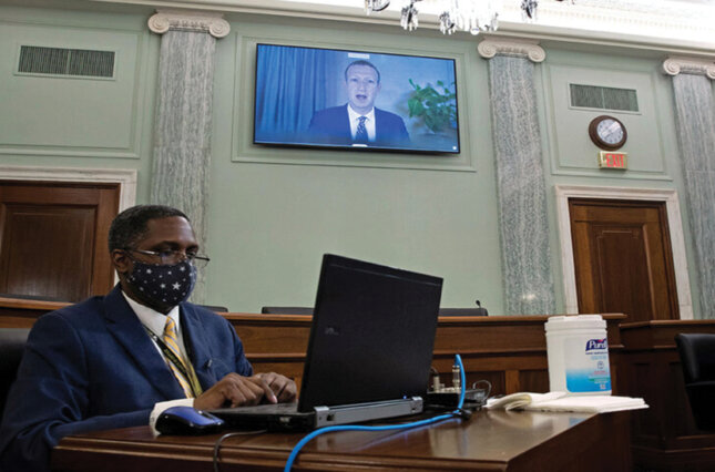 Facebook CEO Mark Zuckerberg appears on a monitor as he testifies remotely on the Senate Commerce, Commerce, and Transportation Committee hearing on October 28, 2020