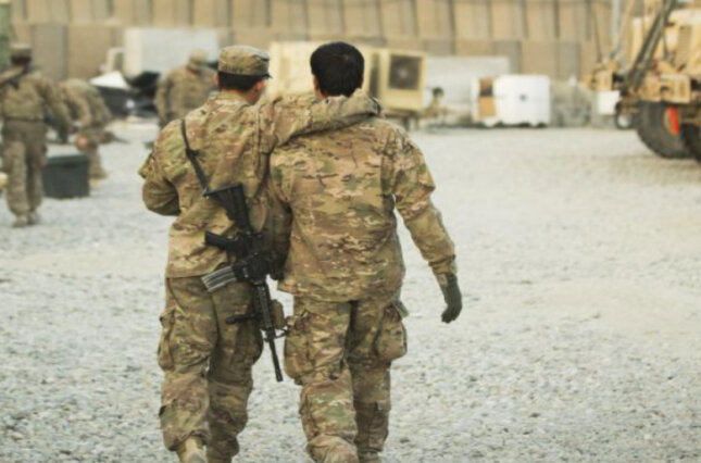 A U.S. soldier with an Afghan interpreter in Laghman province, Afghanistan, December 2014