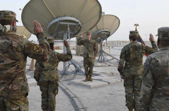 Military men stand in attention