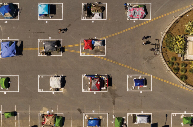 Tents distanced in a parking lot