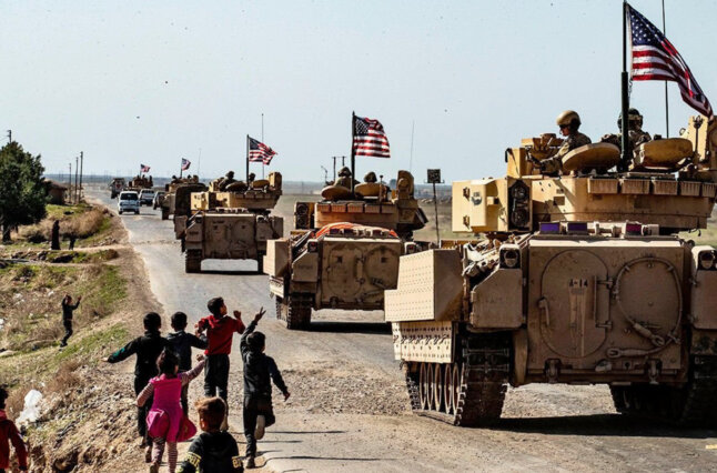 Troops in tanks on rural street