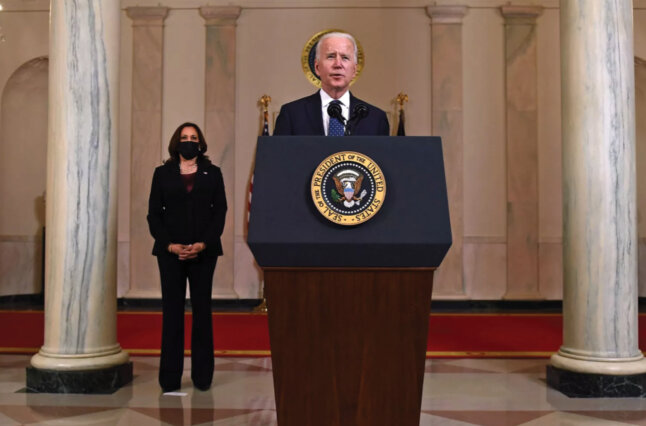 Vice President Kamala Harris listens as President Biden addresses the nation