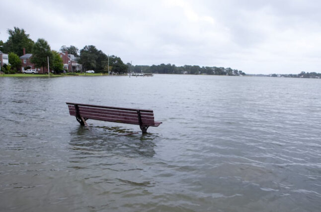 Park bench submerged in water