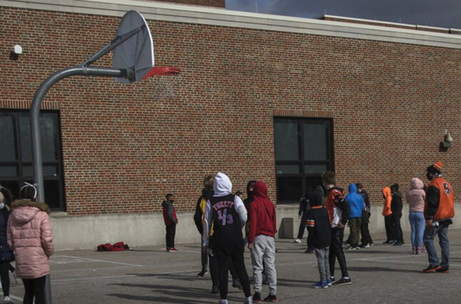 Kids play basketball