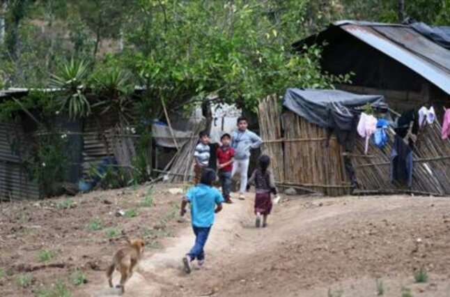 Children play in Las Flores village, Comitancillo, Guatemala, home of a 22-year-old migrant murdered in January 2021 on his journey through Mexico