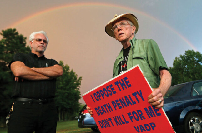 Man holds sign