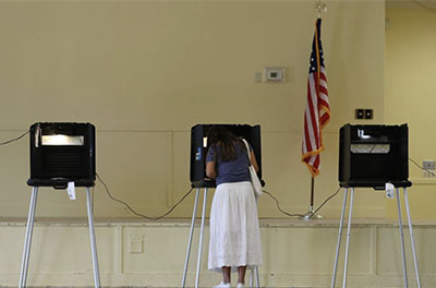 A voter fills out a ballot in Miami on Nov. 3, 2020