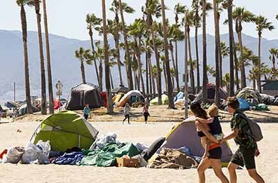 An encampment of tents used by the homeless line Venice Beach in Los Angeles