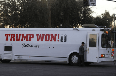 A supporter of Donald Trump arrives by bus at a protest in Phoenix Arizona