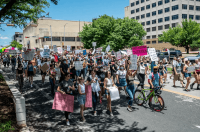 People protest in Texas after the governor signed a bill to outlaw abortion after about six weeks of pregnancy.