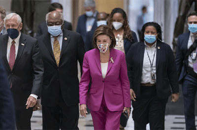 Speaker of the House Nancy Pelosi, D-Calif., center, joined from left by House Majority Leader Steny Hoyer, D-Md., and House Majority Whip James Clyburn, D-S.C., walks to update reporters after day of delays in the vote to advance President Joe Biden's $1.85 trillion-and-growing domestic policy package, at the Capitol in Washington, Friday, Nov. 5, 2021.