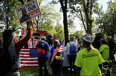 Voting rights activists rally on the Robert A. Taft Memorial and Carillon following a three-day, 70-mile “Freedom to Vote Relay” on Oct. 23.