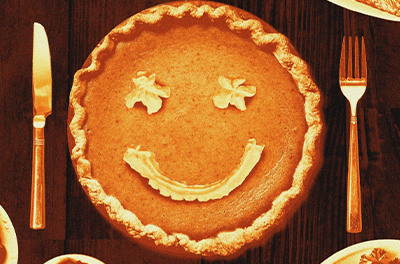 Graphic image of pumpkin pie with smiley face