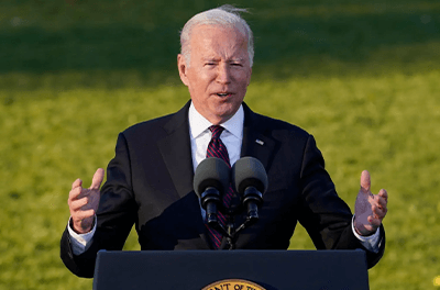 President Biden on the South Lawn of the White House speaking before signing the Infrastructure Bill into law