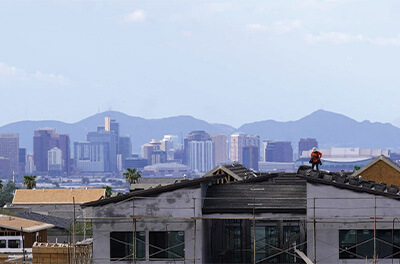 Graphic image of a roofer working on a new home being built in Phoenix, AZ.