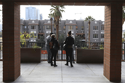 Visitors tour an open house at an affordable housing community in Phoenix, Arizona