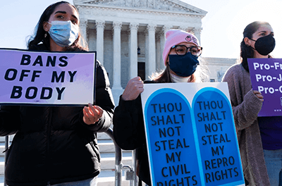 Protesters with Catholics for Choice join an abortion-rights rally outside the Supreme Court