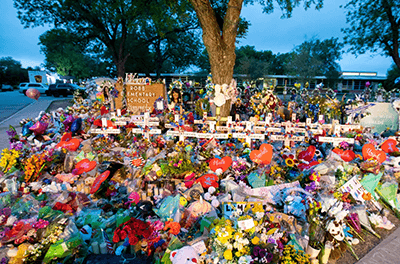 Flowers piled in a memorial to the Uvalde school shooting victims