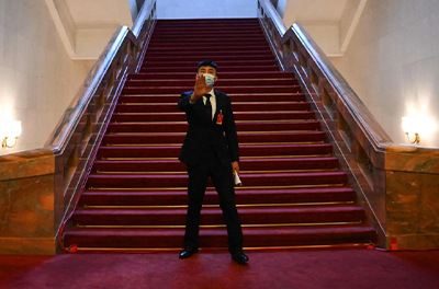 A member of security staff inside the Great Hall of the People in Beijing on Sunday.