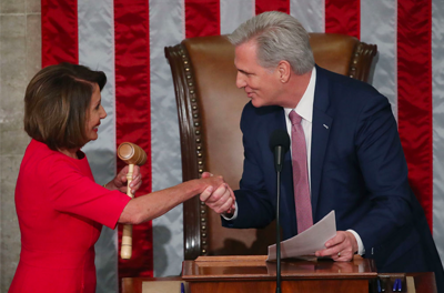 Nancy Pelosi shaking Kevin McCarthy's hand