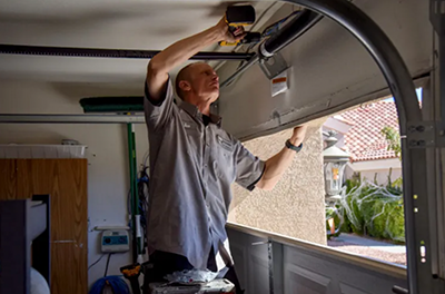 Ian Black, a former convict, installs a residential garage door as a technician for Pioneer Overhead Doors