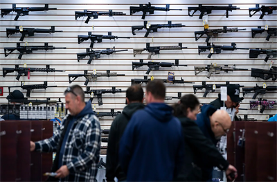 Shoppers in a gun store.