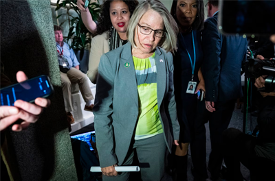 Rep. Mariannette Miller-Meeks (R-Iowa) leaves a GOP conference meeting Thursday. Miller-Meeks is one of many holdouts against the speaker candidacy of Rep. Jim Jordan (R-Ohio) who have cited intimidation and threats from Jordan’s backers.