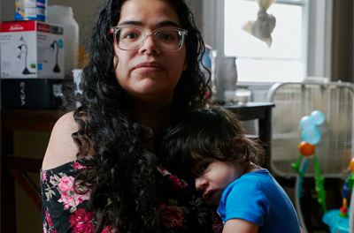 Sukky Bleck, a 27-year-old mother of two, in her home with lead pipes in Chicago.