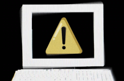 A computer screen with a yellow caution sign on it.